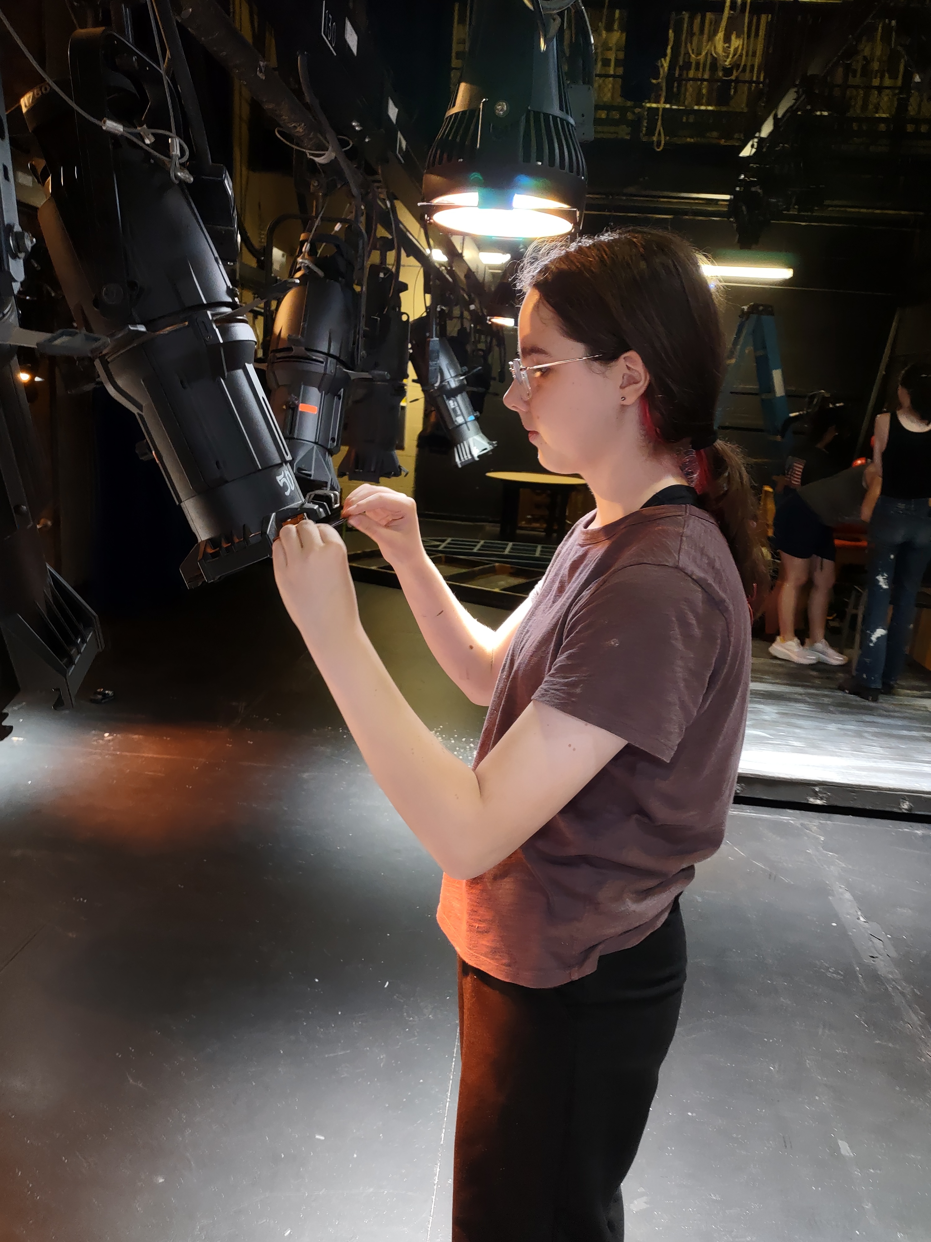 An image of me dropping gels in a theater.