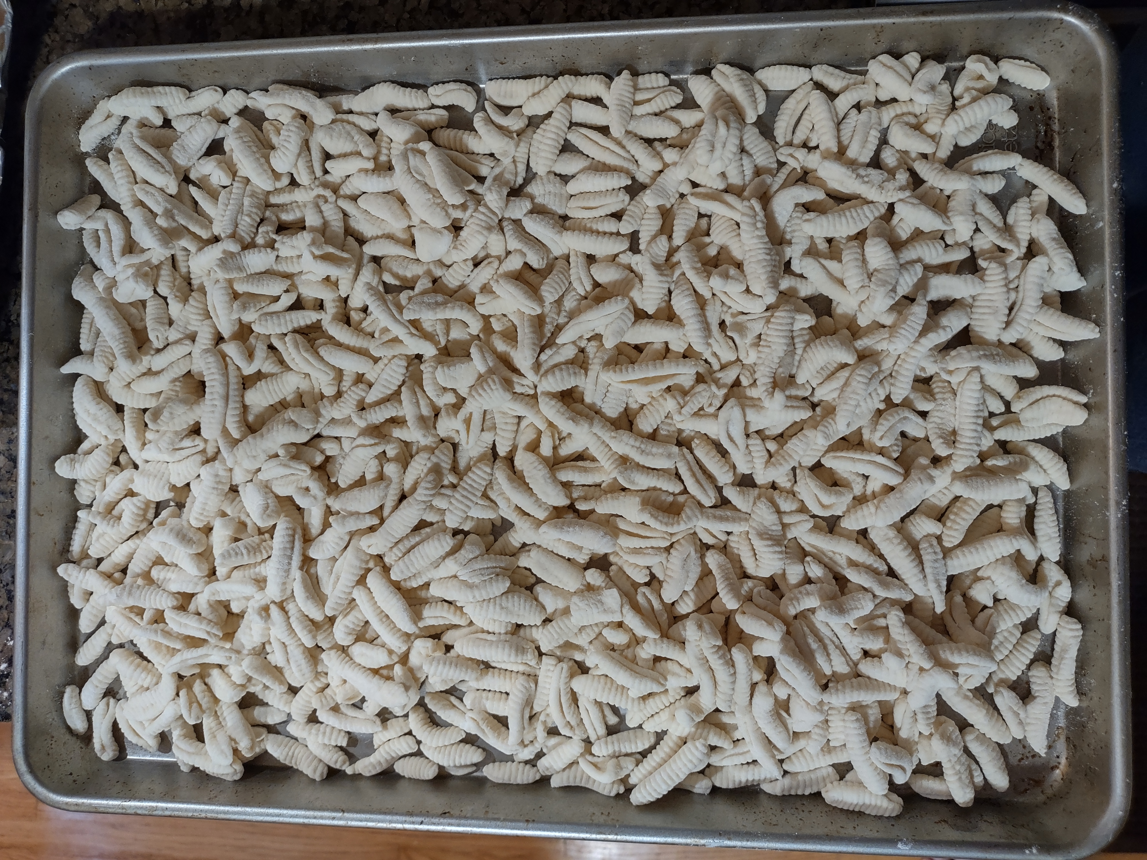 An image of gnocchi laying on a sheet.